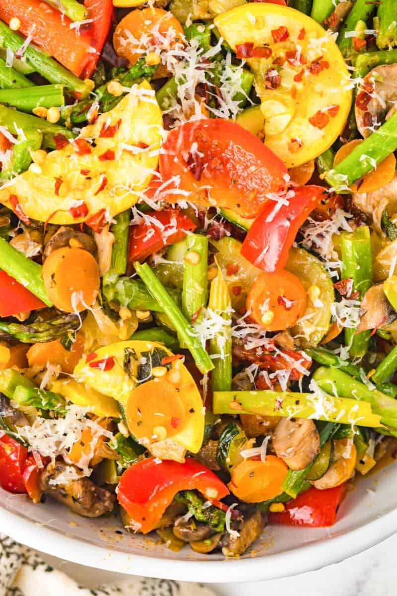 overhead image of sauteed vegetables in a white serving bowl