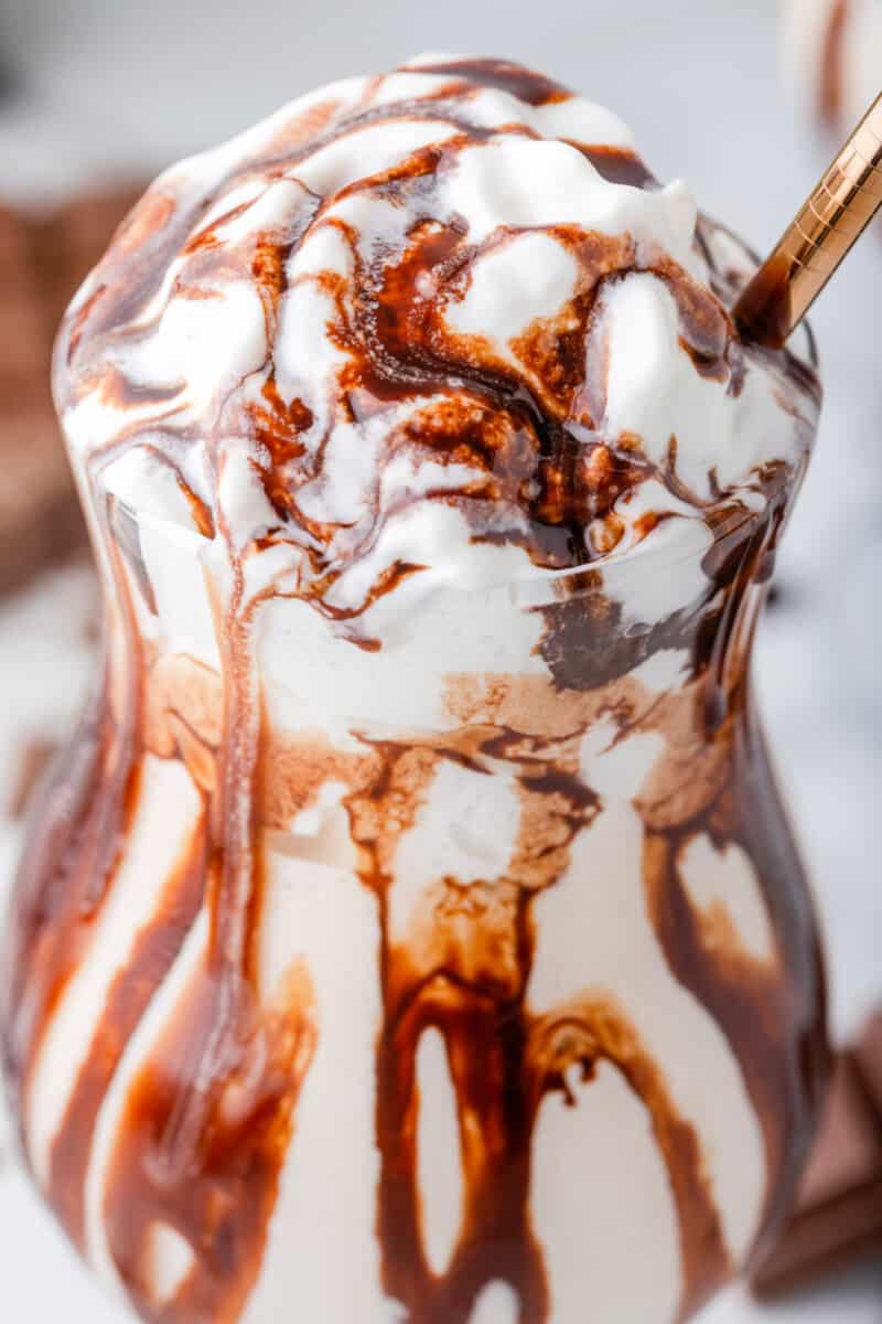 close up view of a frozen mudslide with a gold straw.