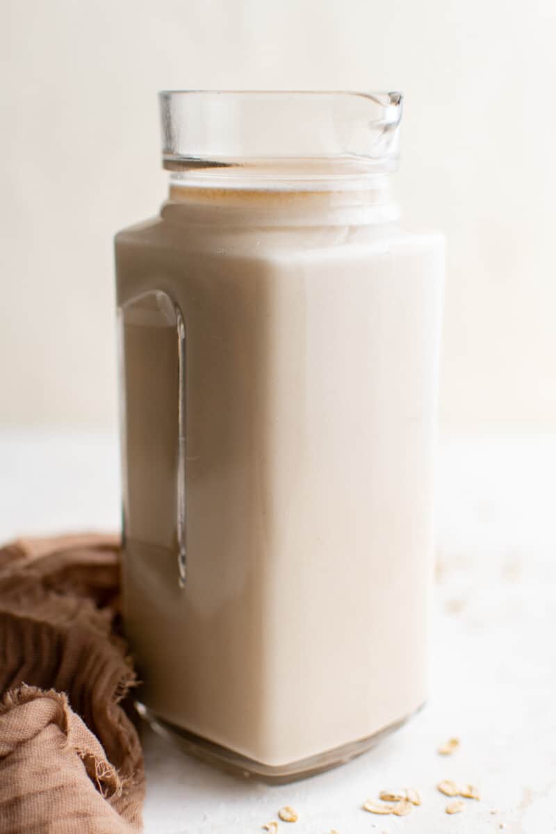 How to make oat milk in a glass pitcher.