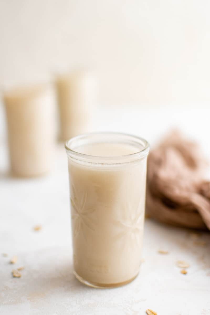 oat milk in a tall round glass