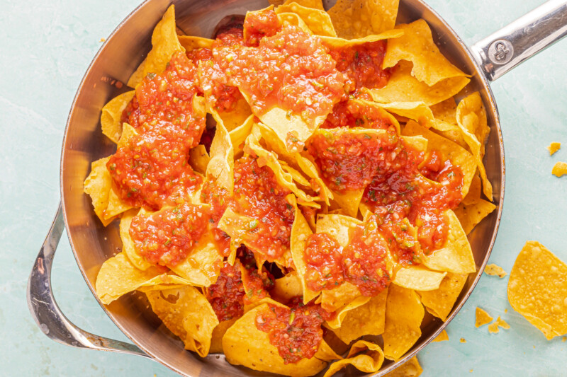 Chips and salsa in a sauté pan before cooking.