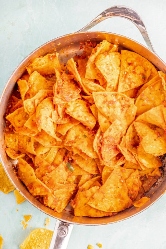 Chips and salsa in a sauté pan after cooking.