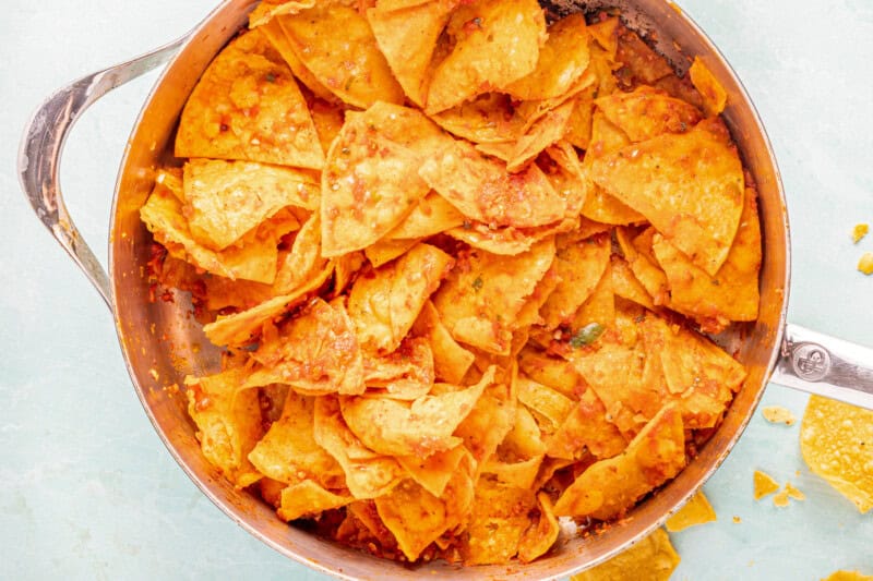 Chips and salsa in a sauté pan after cooking.