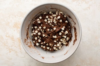overhead view of chocolate cake mix cookie dough in a white bowl.