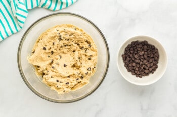 overhead view of bowls with dough and chocolate chips.