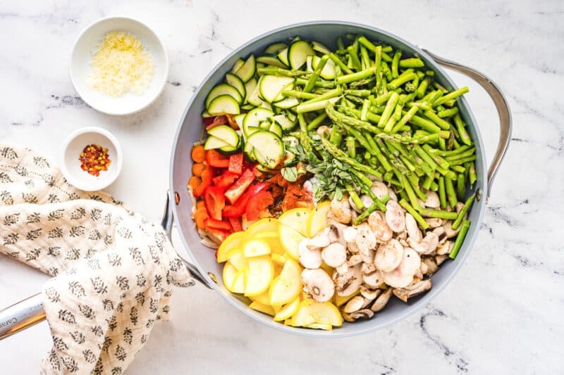 chopped vegetables in a saute pan before cooking