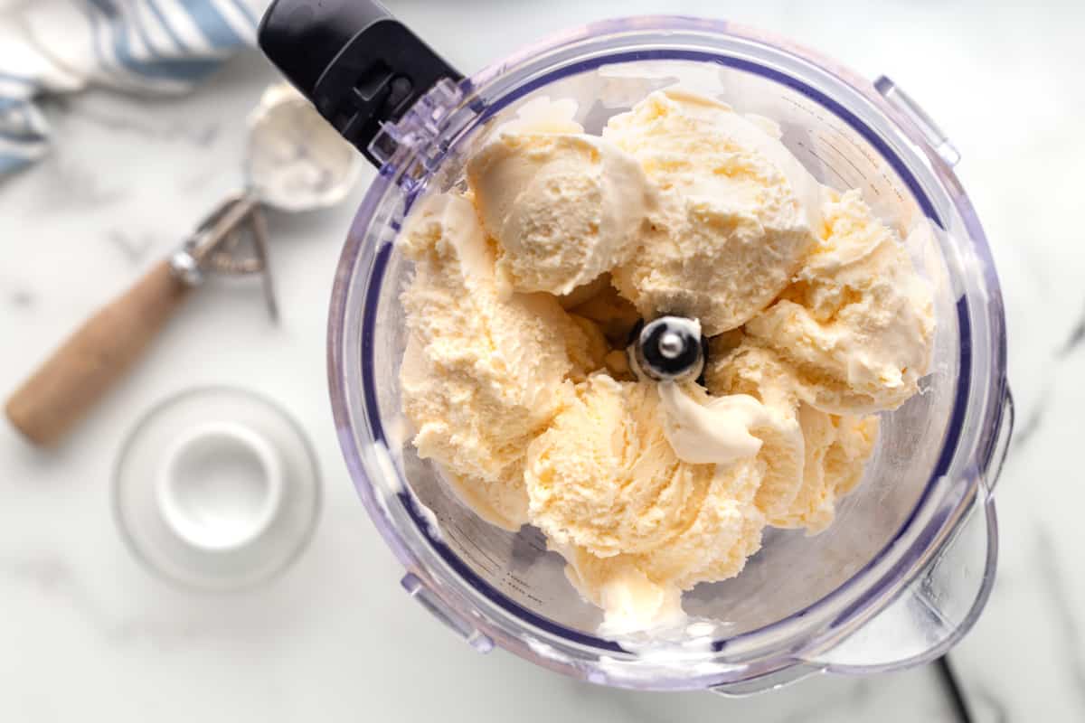overhead view of ice cream in a blender for frozen mudslide.
