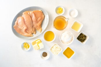 Overhead view of ingredients for chicken piccata.