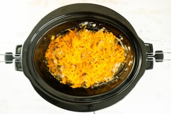 cheesy crockpot chicken and rice in a crockpot.