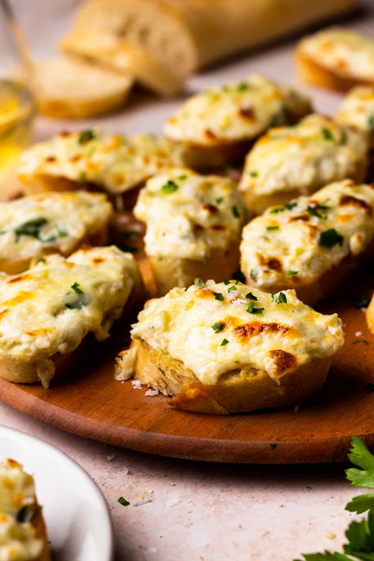 artichoke bruschetta on a wooden platter