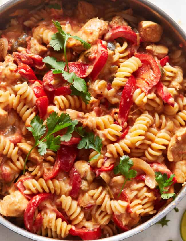 overhead view of chicken fajita pasta in a skillet.