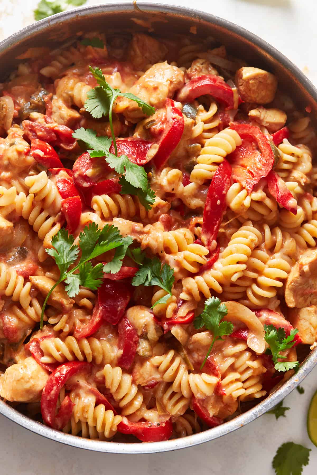 overhead view of chicken fajita pasta in a skillet.