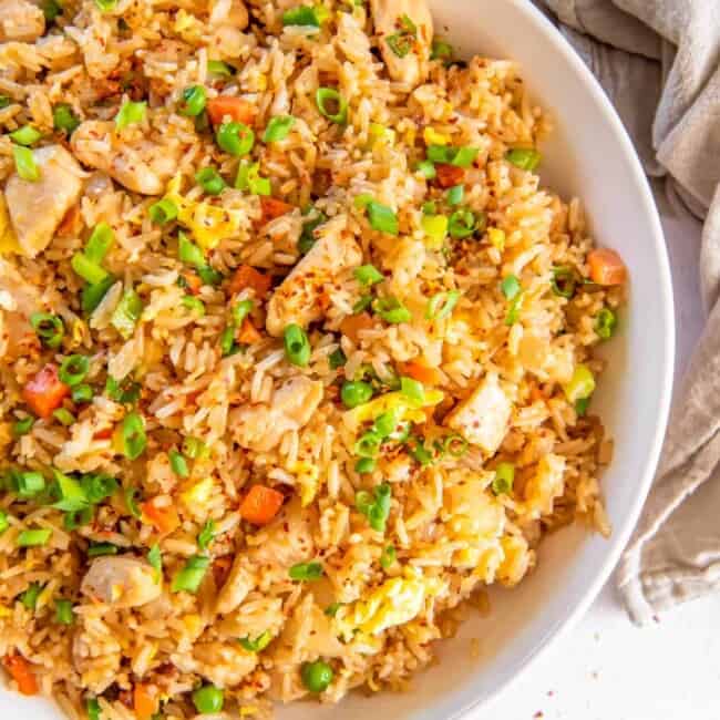 chicken fried rice in a white bowl.