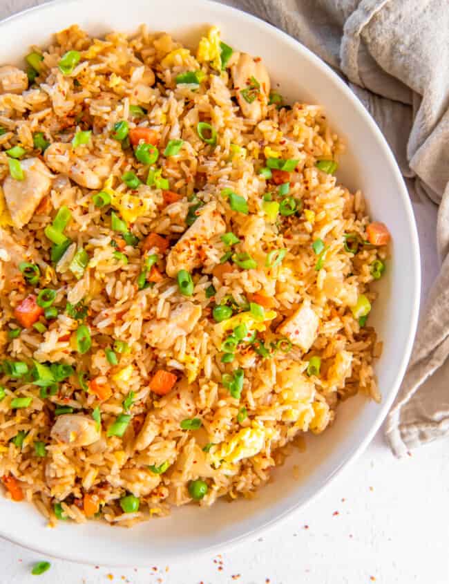chicken fried rice in a white bowl.