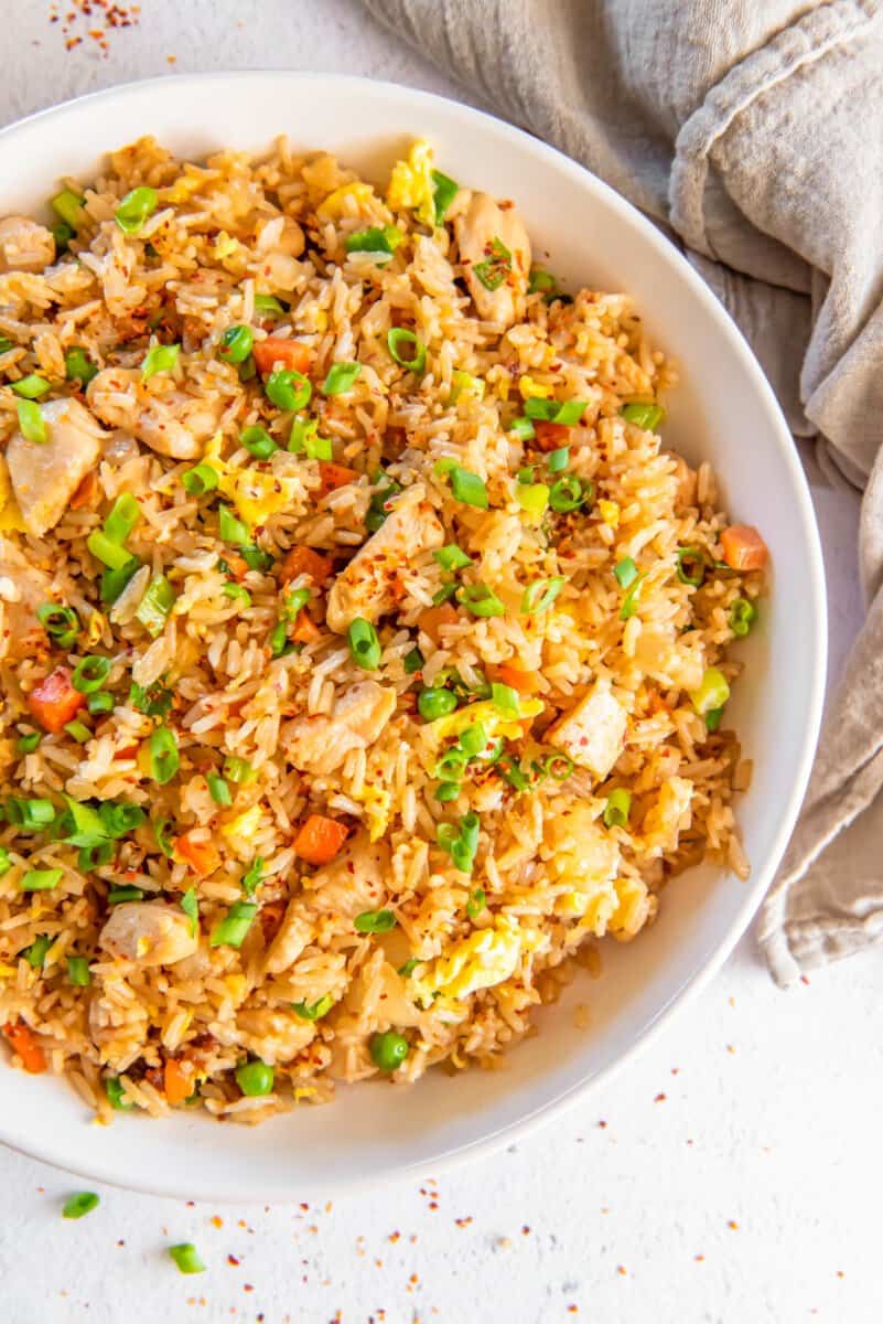 chicken fried rice in a white bowl.