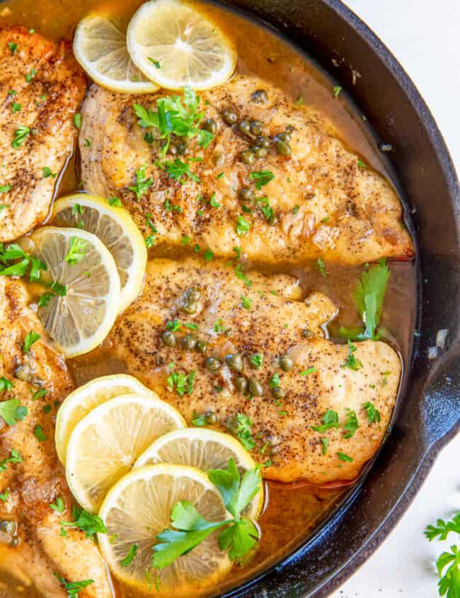 Close up of chicken piccata in a skillet.