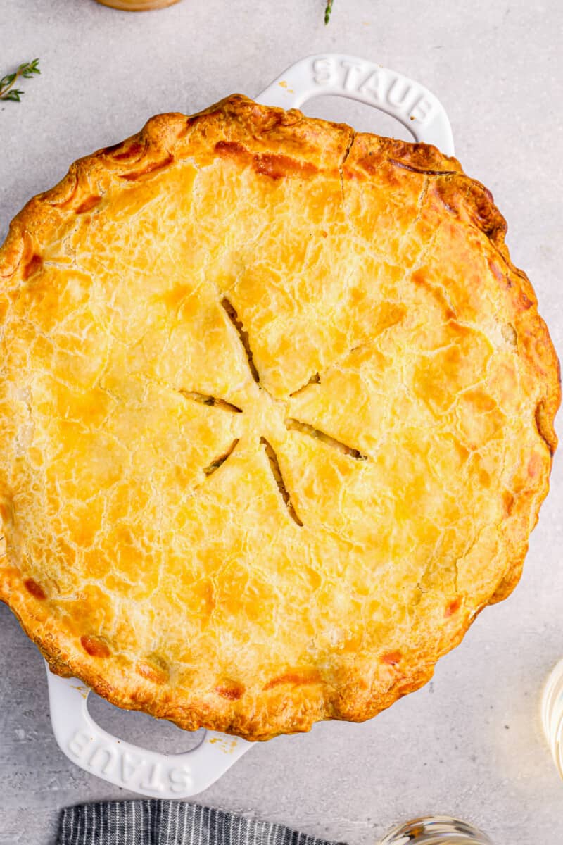 overhead view of chicken pot pie in a white pie pan.