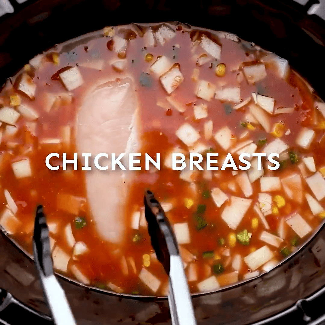 Chicken breasts added to the crockpot.