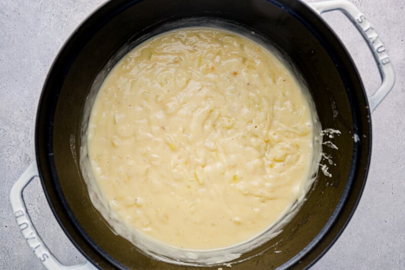 chicken pot pie filling base in a white dutch oven.