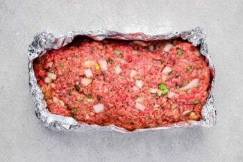 shaped instant pot meatloaf wrapped in aluminum foil.