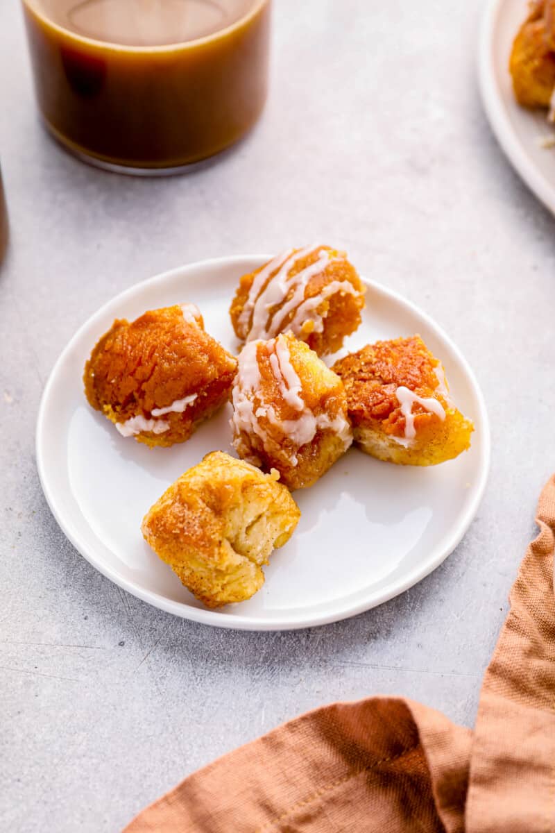 5 easy monkey bread biscuit balls on a white plate.