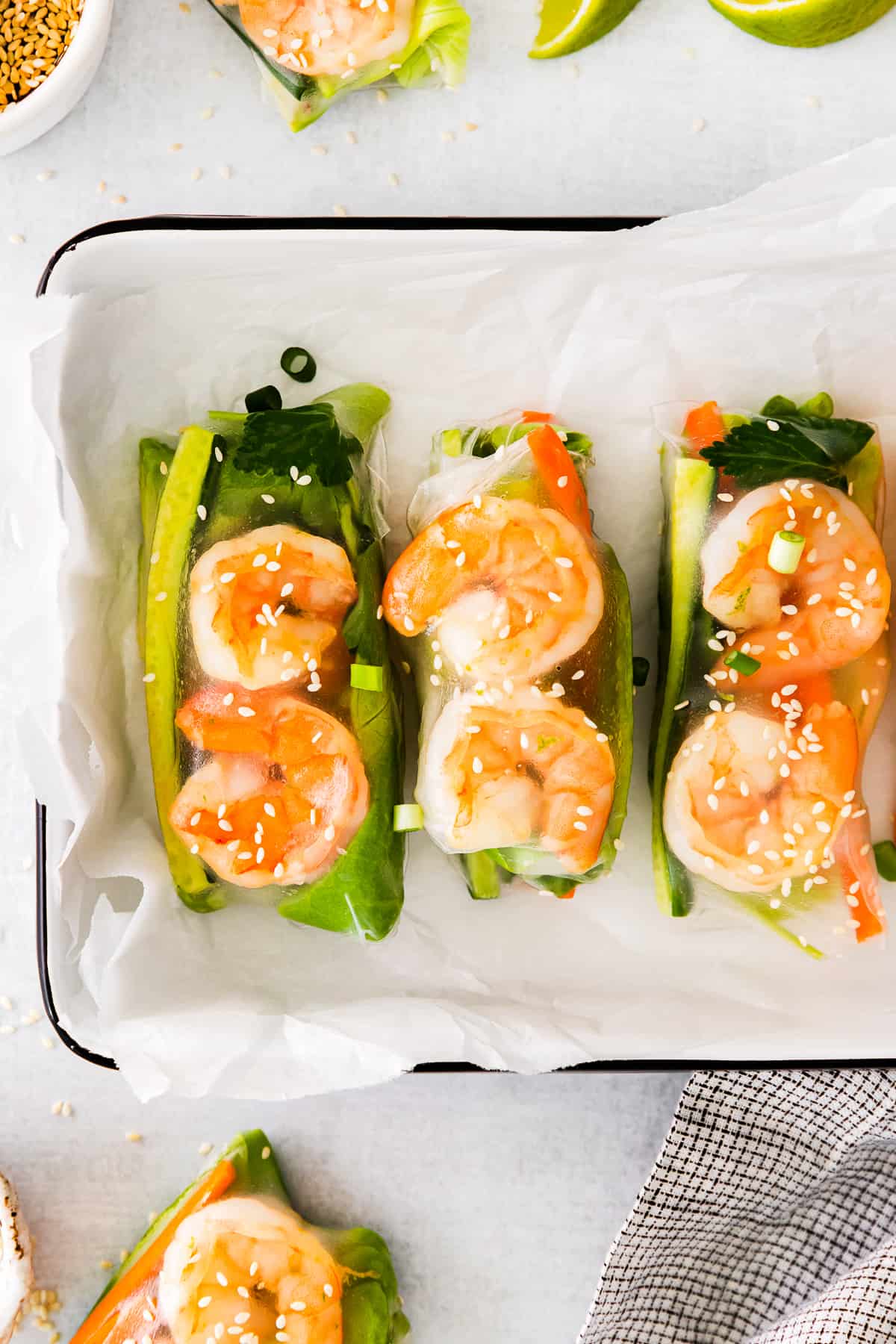 close up of shrimp summer rolls in a rectangular tray.
