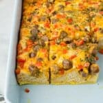 cut biscuit breakfast casserole in a baking pan.