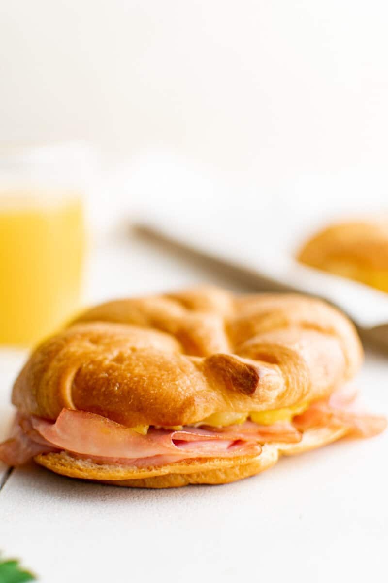 croissant breakfast sandwich on a table.
