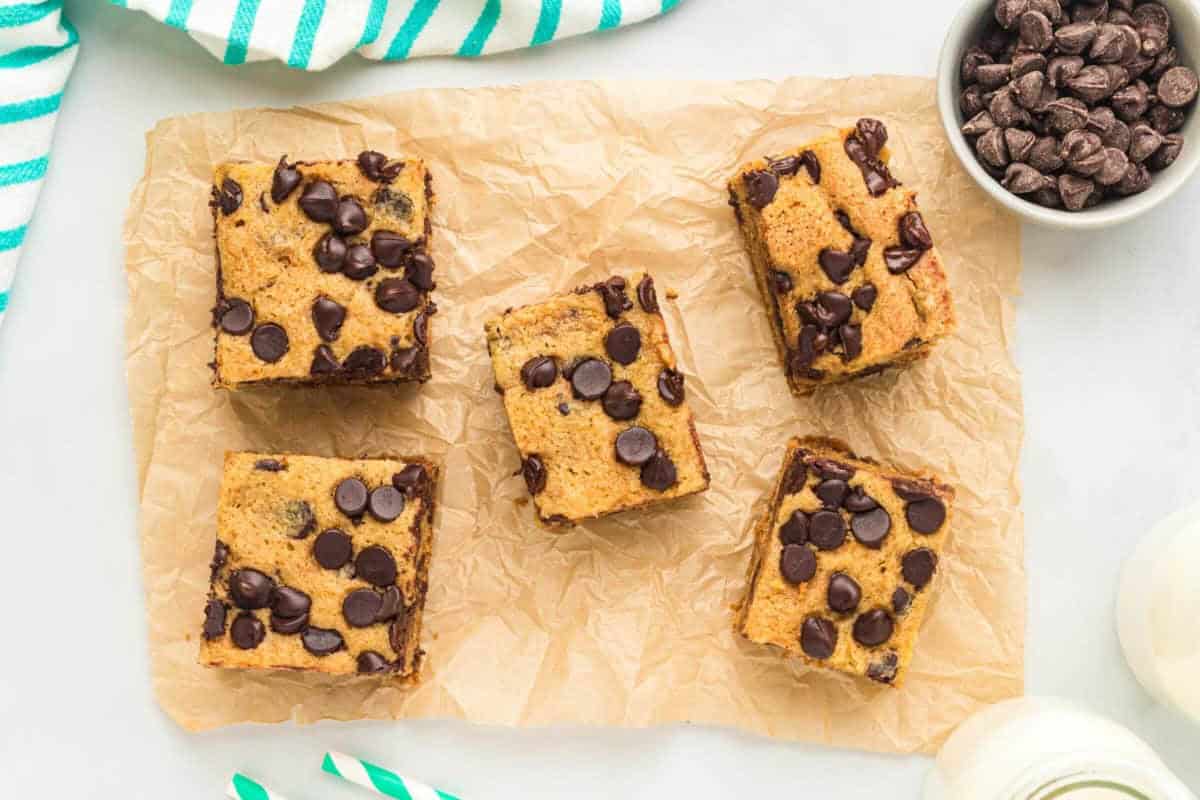 5 chocolate chip cookie bars on parchment paper.