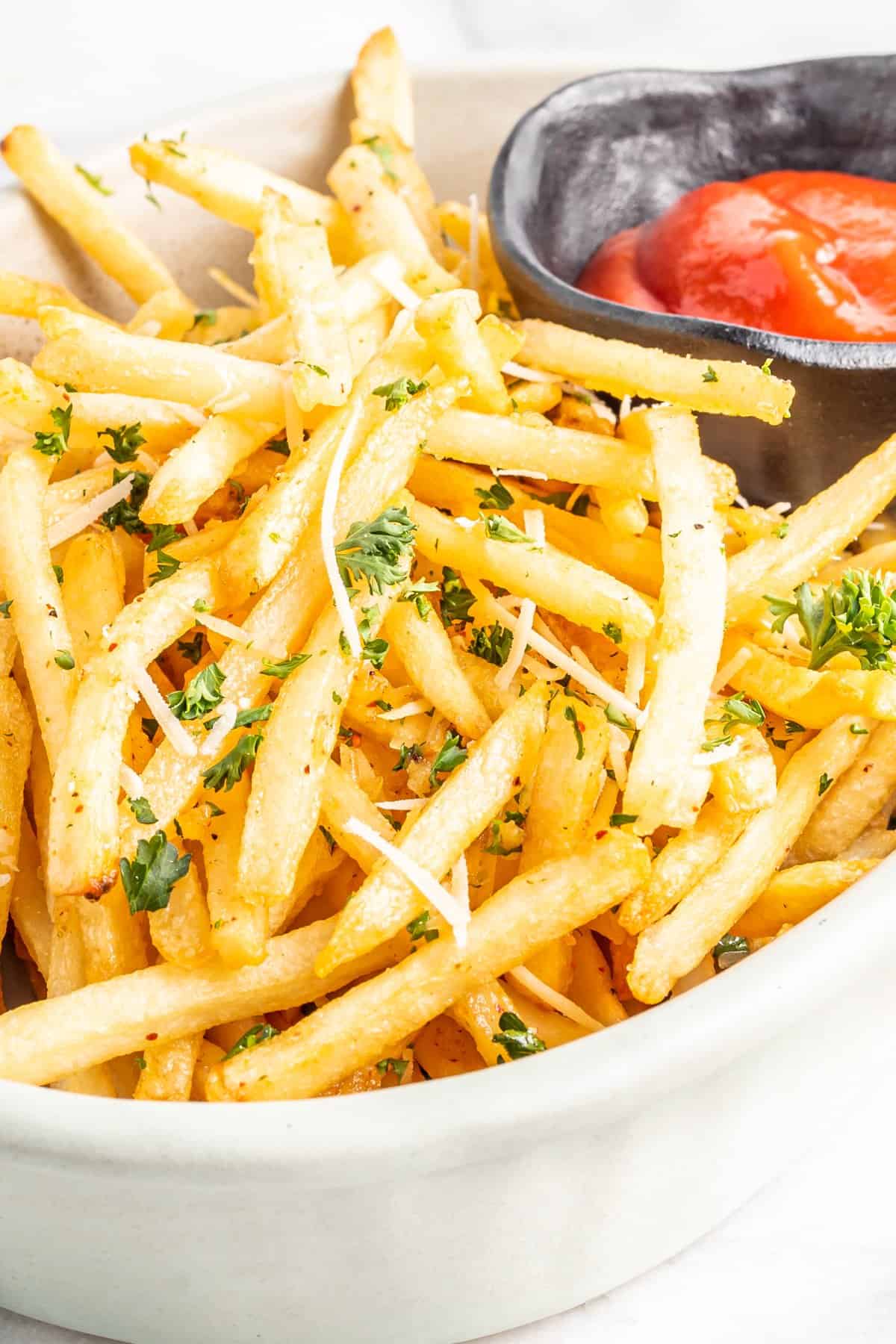 French fries in a bag with ketchup and mayonnaise Stock Photo by