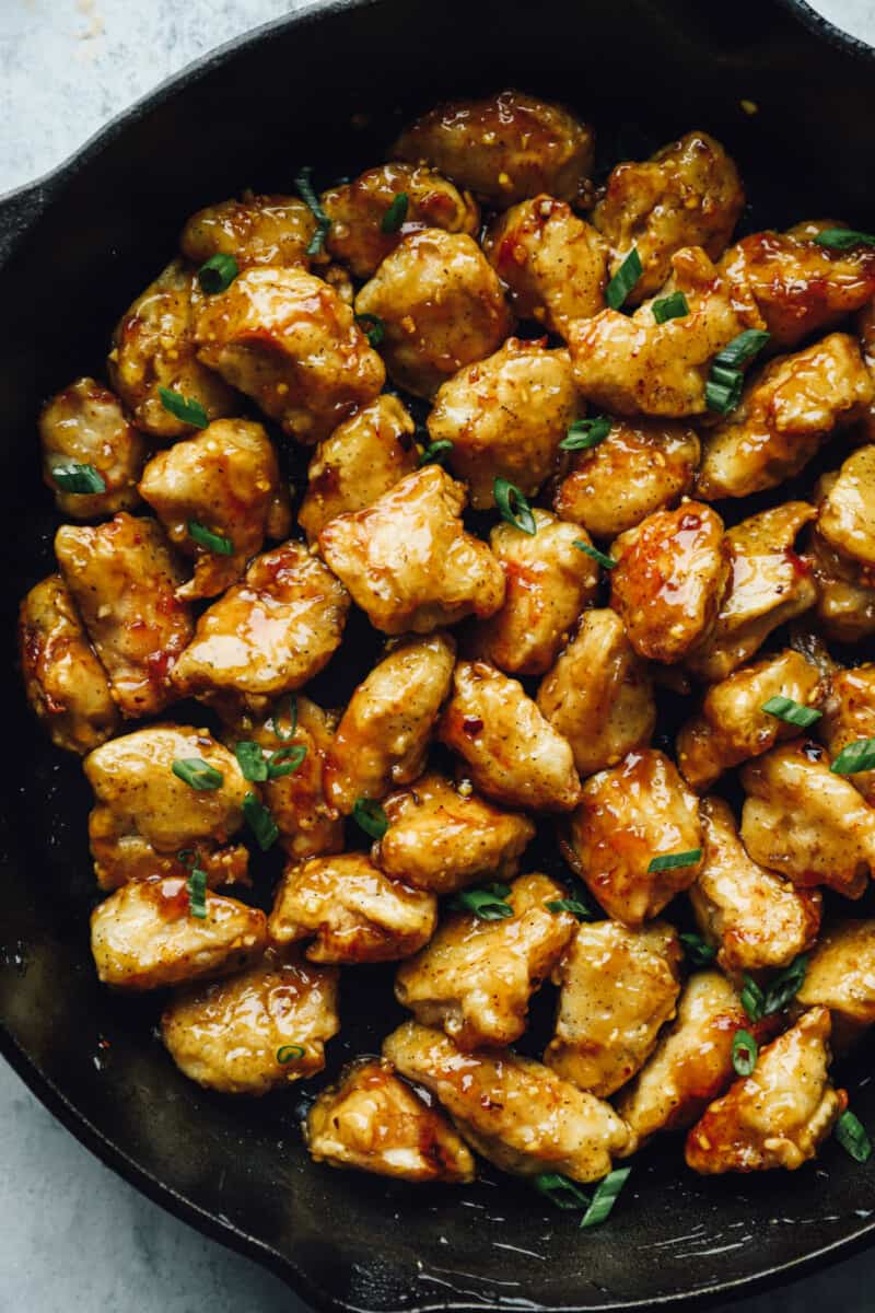 close up of honey chicken in a skillet.