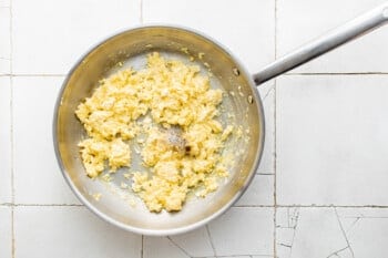 scrambled eggs in a frying pan.