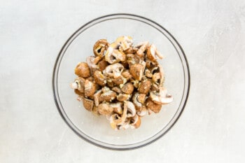 sliced mushrooms in a glass bowl.