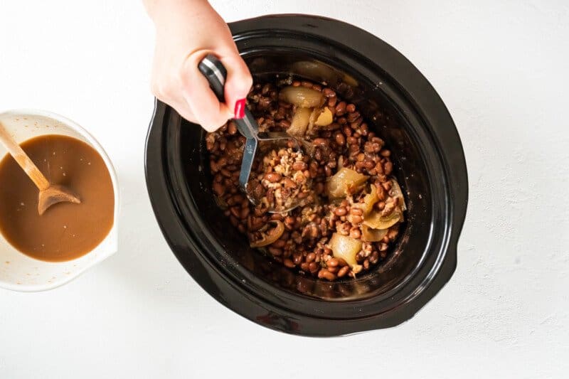 cooked beans stirred in a crockpot.