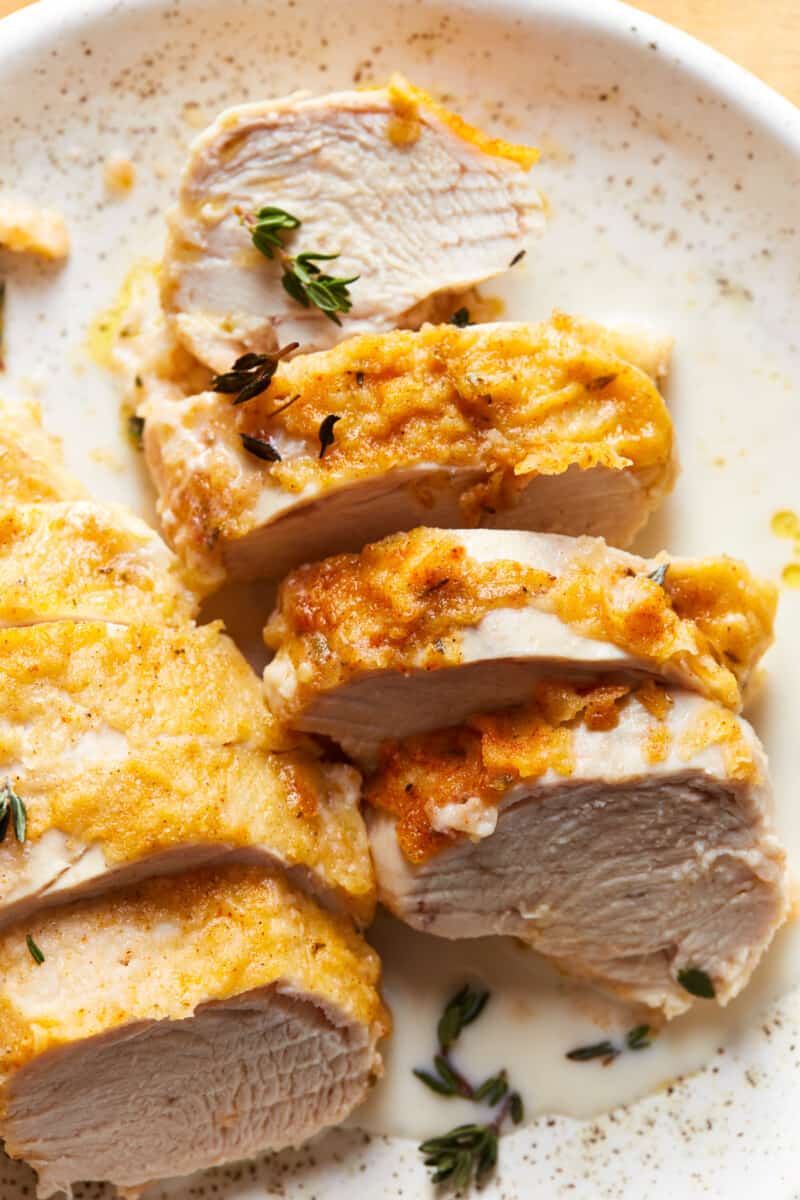 butter baked chicken sliced up on a plate
