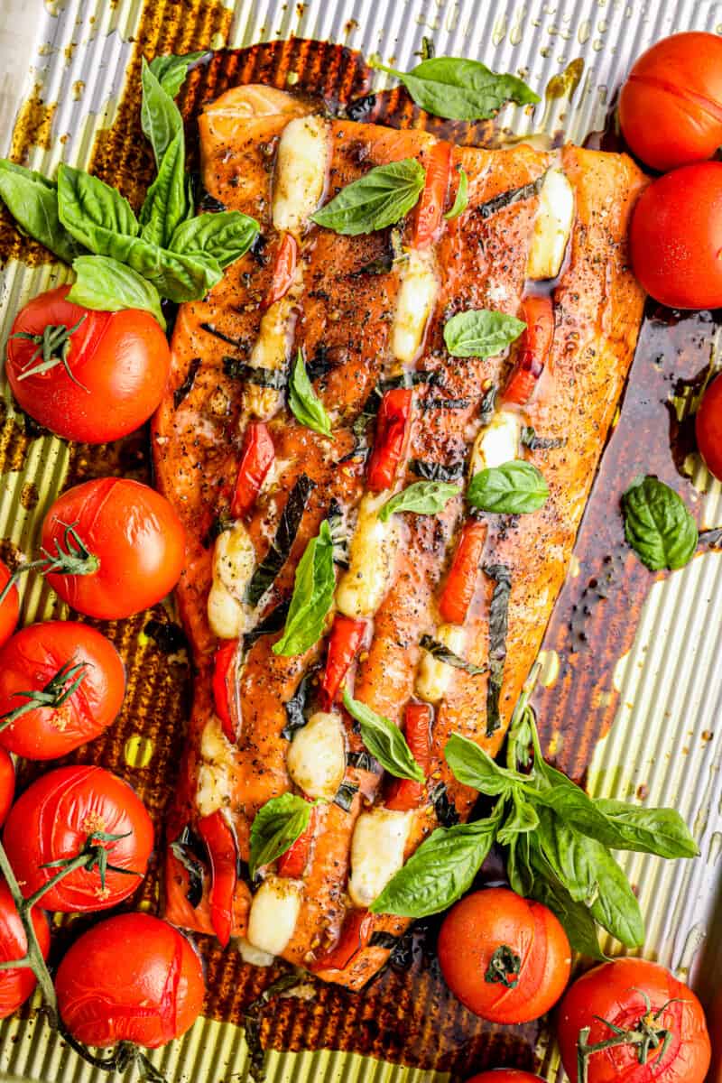 caprese stuffed salmon with roasted tomatoes and balsamic