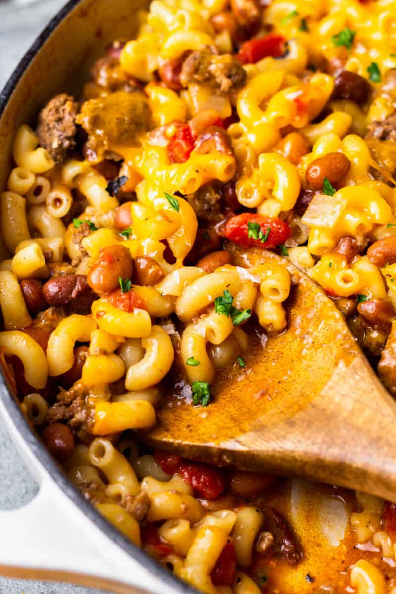 close up on a spoon digging into chili mac