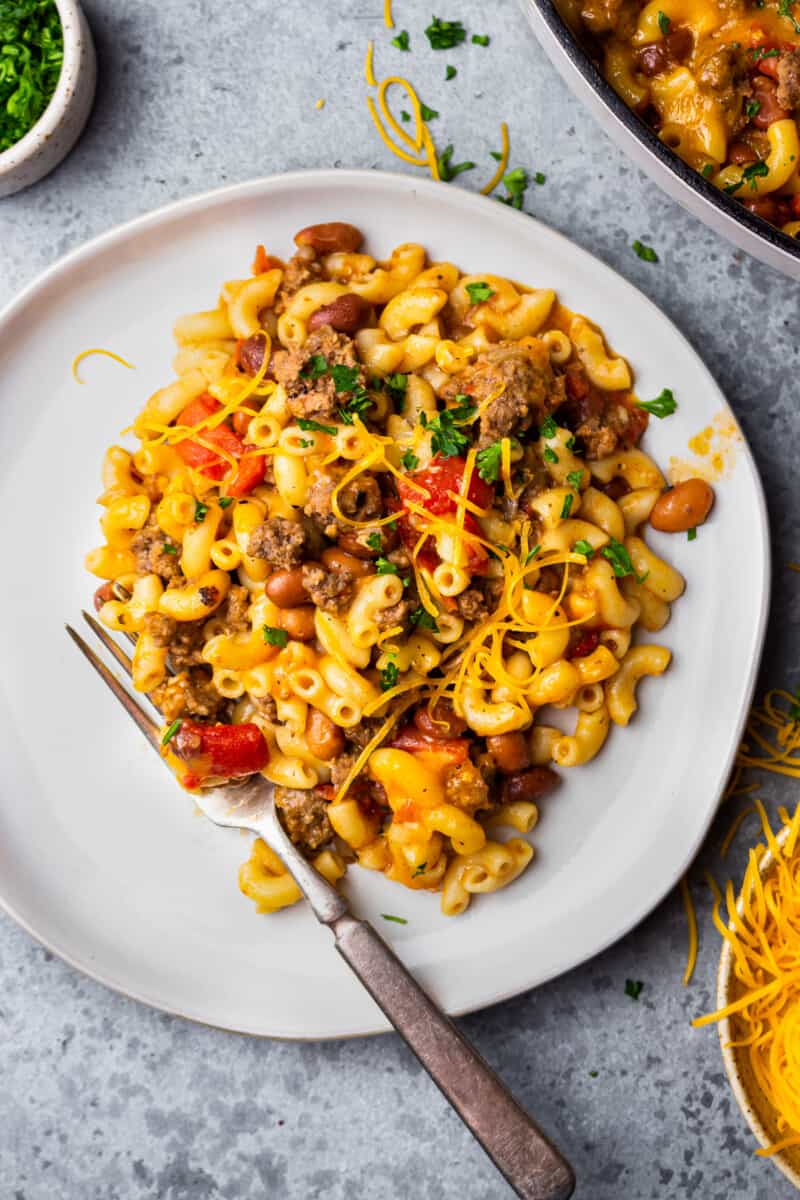a plate of chili mac and cheese with a fork