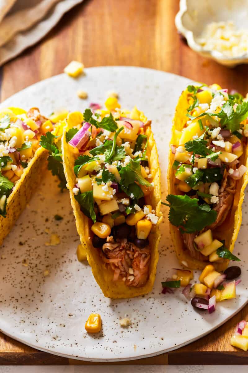 bbq chicken taco topped with beans and corn
