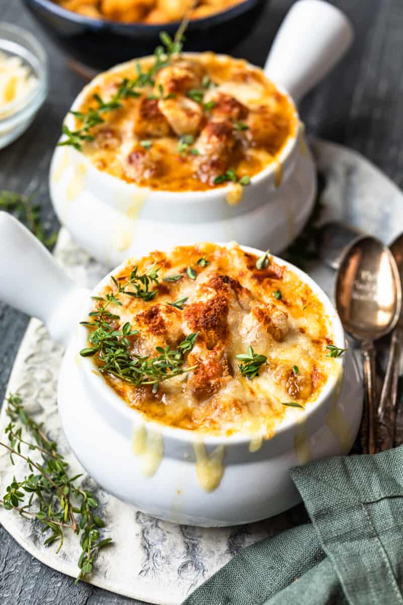 french onion soup in white bowls.