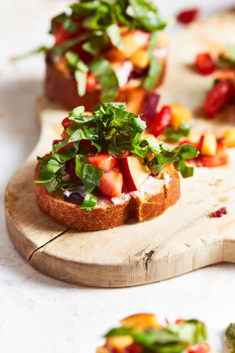 fruit topped appetizer on a serving board