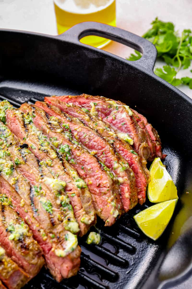 flank steak cut up in a grill pan