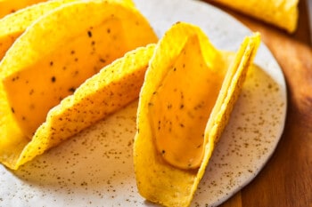 hard taco shells with a slice of cheese in each