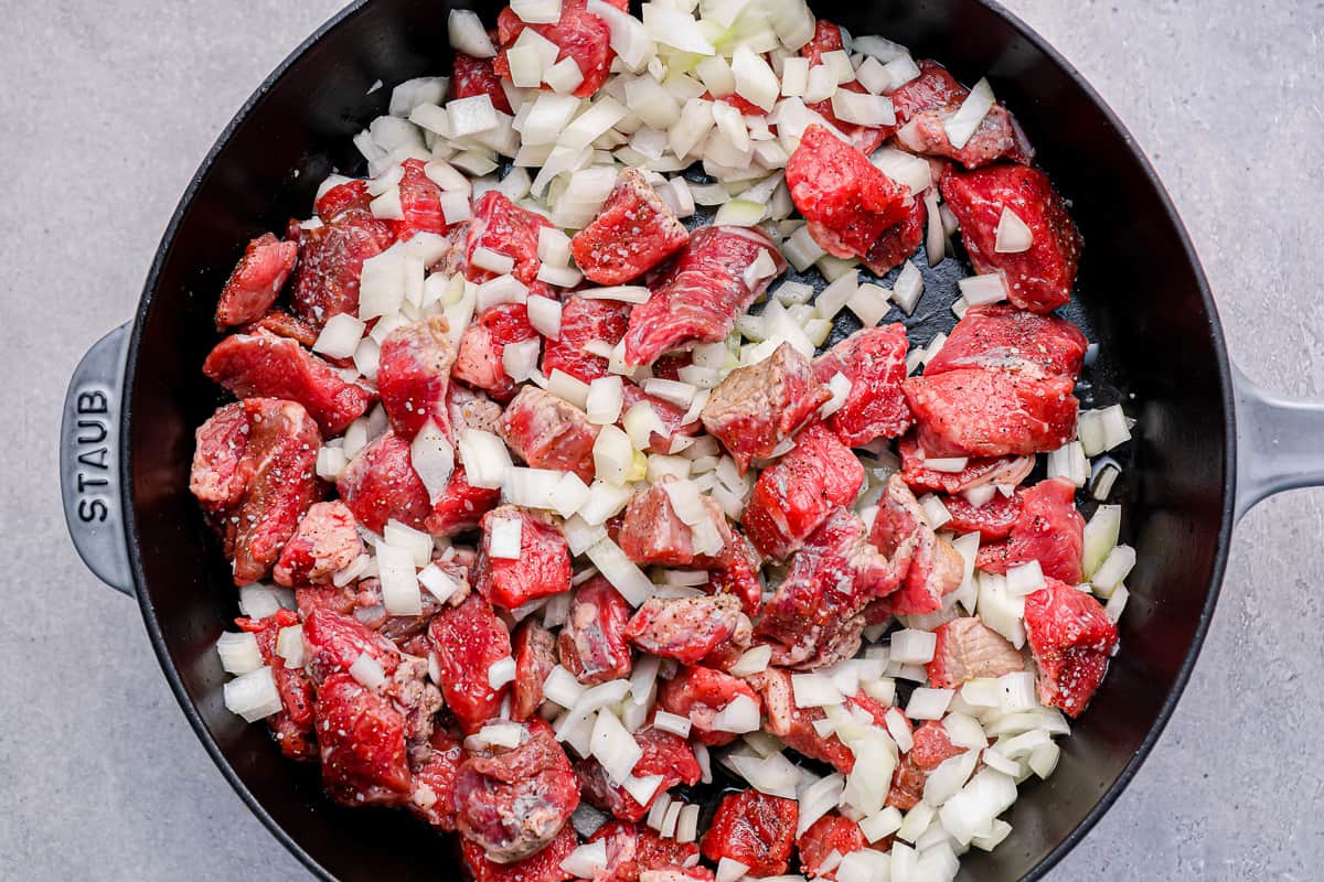 beef and onion in a skillet.