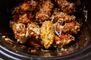 close up on garlic parm wings in a crockpot