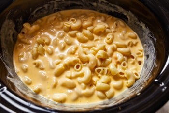 close up on creamy mac and cheese in a crockpot
