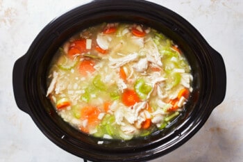 crockpot filled with tuscan chicken soup ingredients