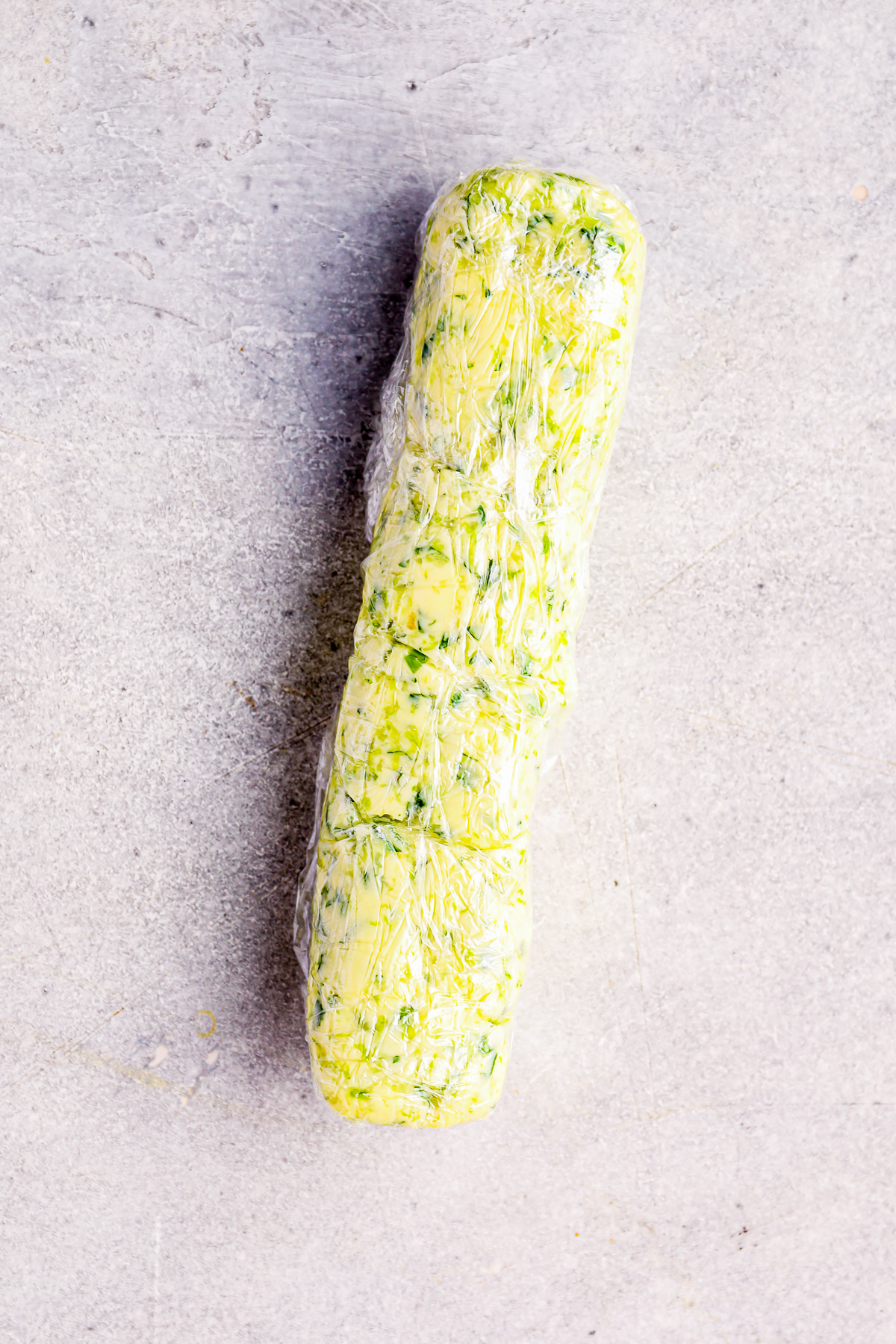 cilantro lime butter wrapped in plastic wrap