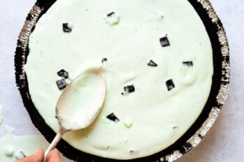 making an ice cream pie, smoothing ice cream into place with a spoon