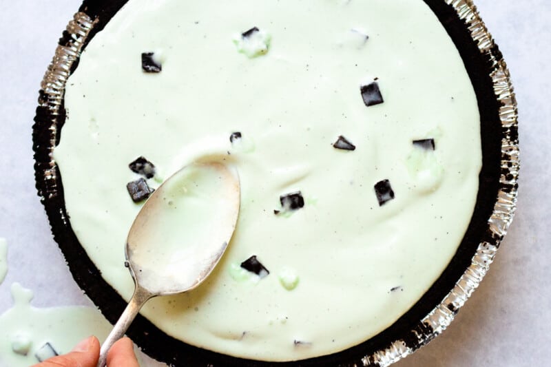 making an ice cream pie, smoothing ice cream into place with a spoon